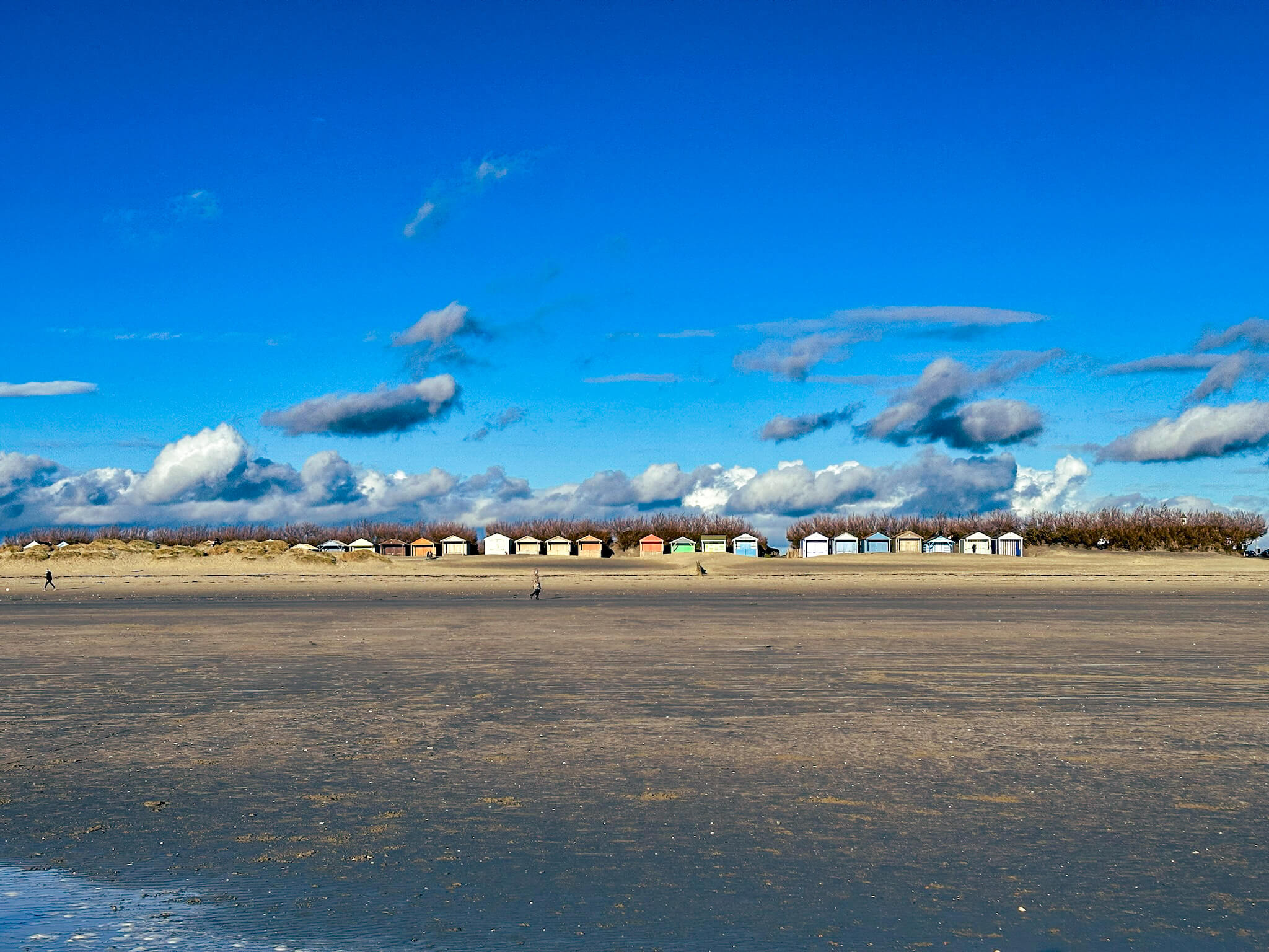 wide view of beach with beach huts