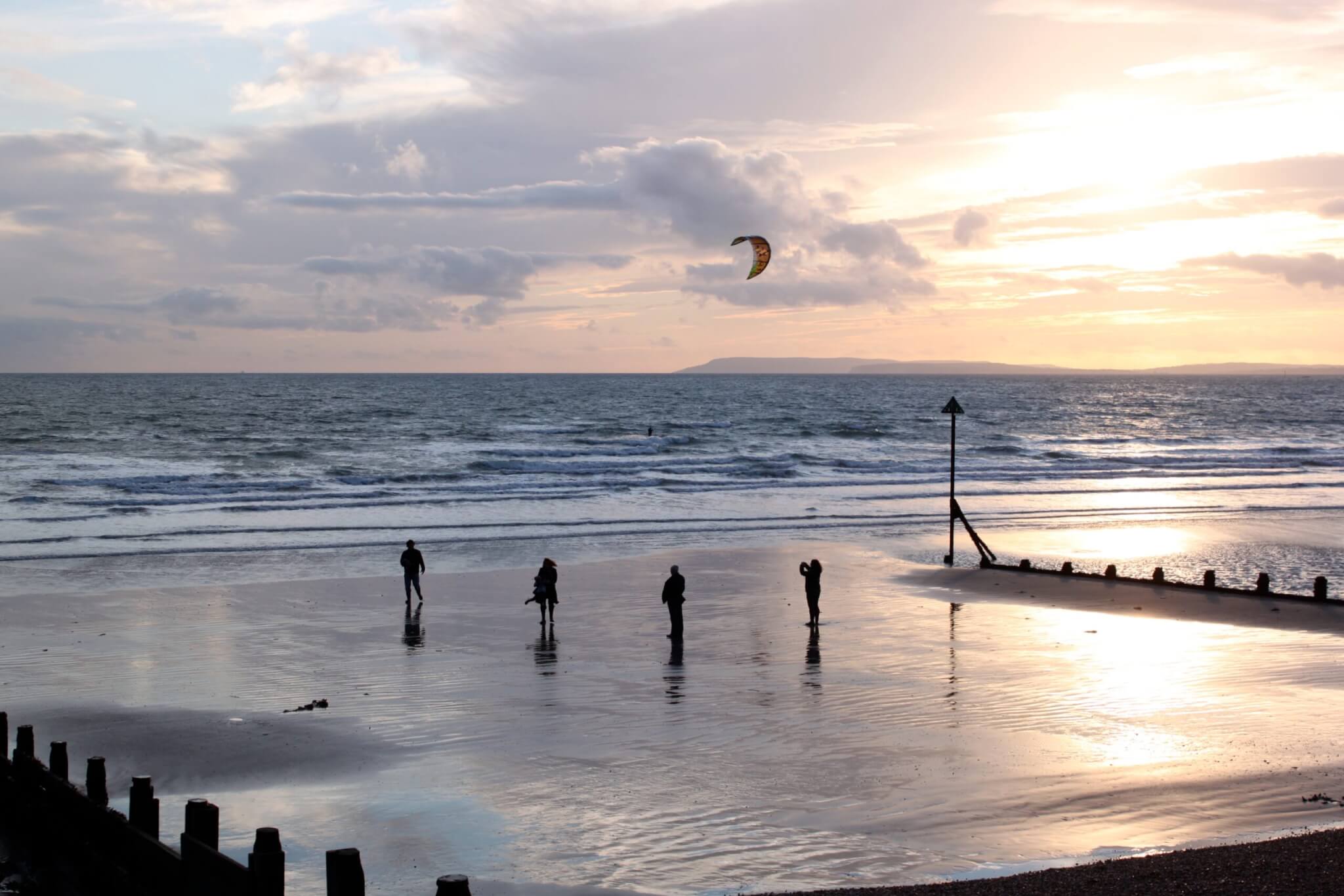 7. Home page gallery - people on beach and kite surfer